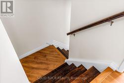 Large landing 2/3 of way to top, solid handrail -