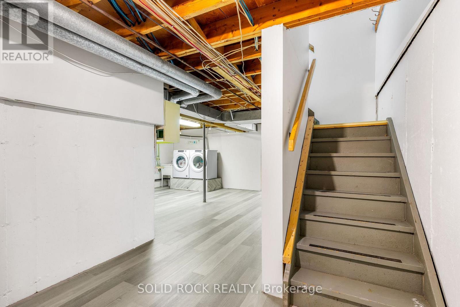 Solid wood stairs to lower - 29 Windfield Crescent, Kingston (Kingston East (Incl Barret Crt)), ON - Indoor Photo Showing Basement