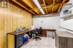 Sewing room-modern flooring, unfinished ceiling -