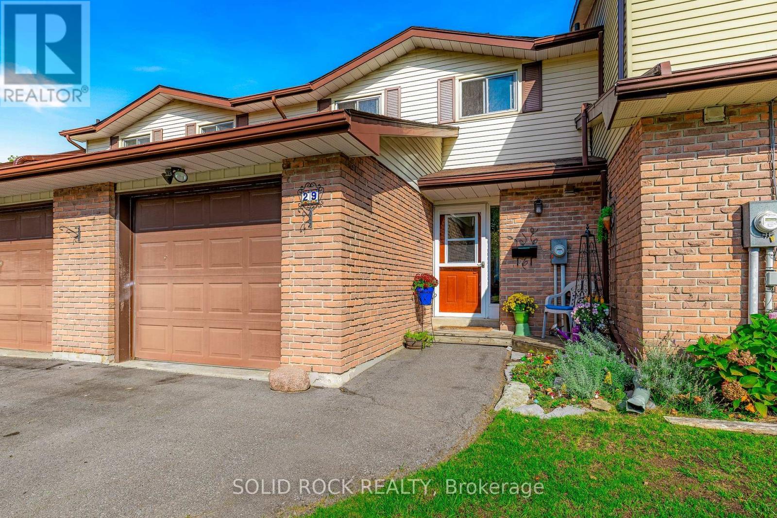 Paved drive-pristine walkway & gardens - 29 Windfield Crescent, Kingston (Kingston East (Incl Barret Crt)), ON - Outdoor With Exterior