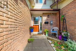 Nice entrance with mini exterior sitting area -