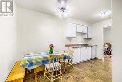 Eat-in kitchen with impeccable vinyl flooring -