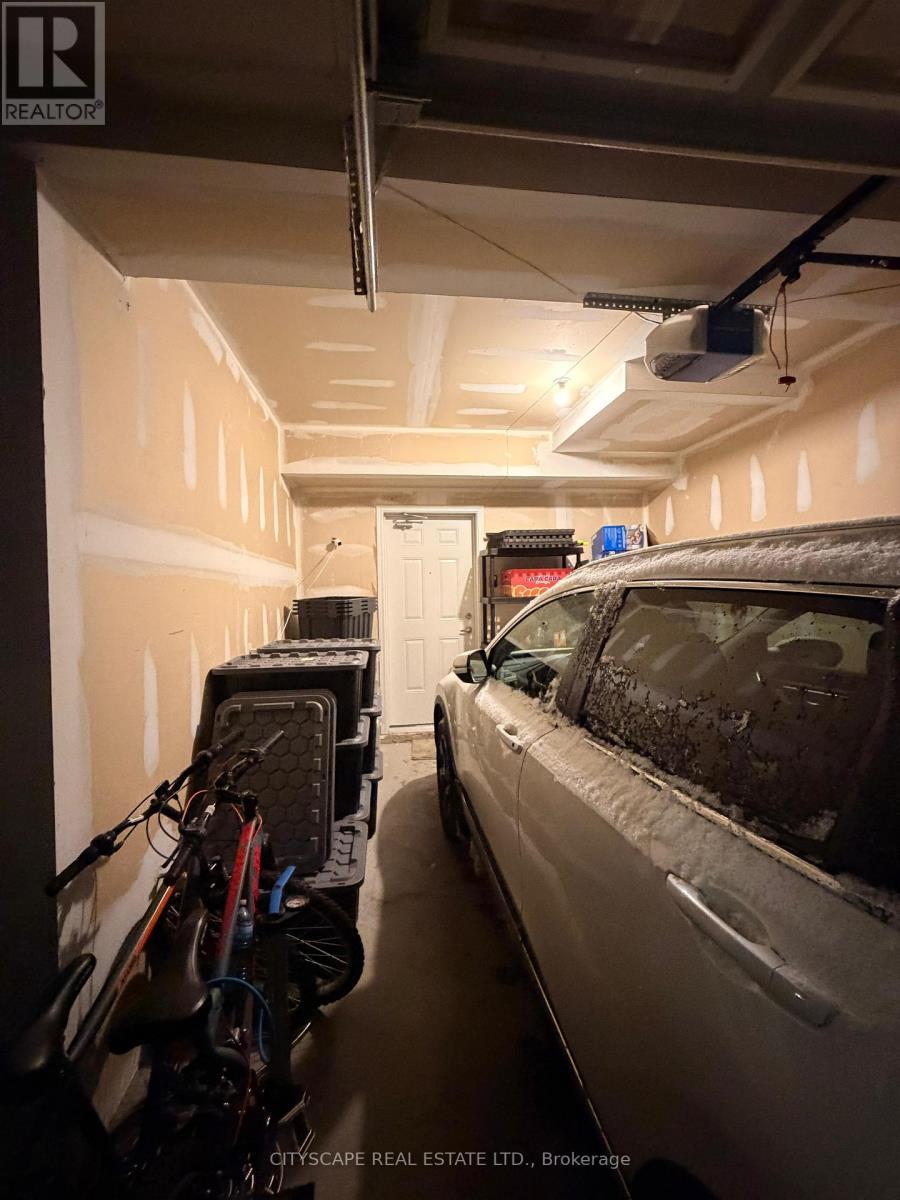 57 - 250 Sunny Meadow Boulevard, Brampton, ON - Indoor Photo Showing Garage