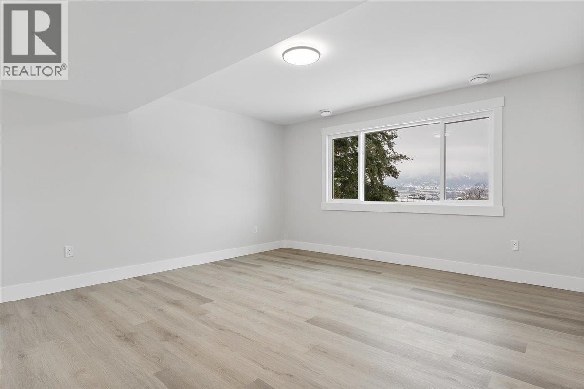 Third Bedroom lower level - 6535 Blue Jay Road, Vernon, BC - Indoor Photo Showing Other Room