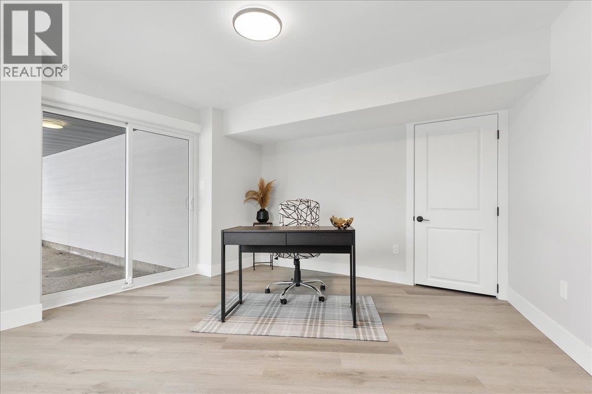 Fourth Bedroom or home office with access to covered patio - 6535 Blue Jay Road, Vernon, BC - Indoor Photo Showing Other Room