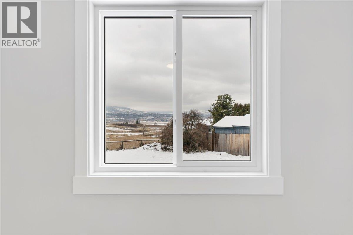 View from fourth bedroom or office - 6535 Blue Jay Road, Vernon, BC - Indoor Photo Showing Other Room