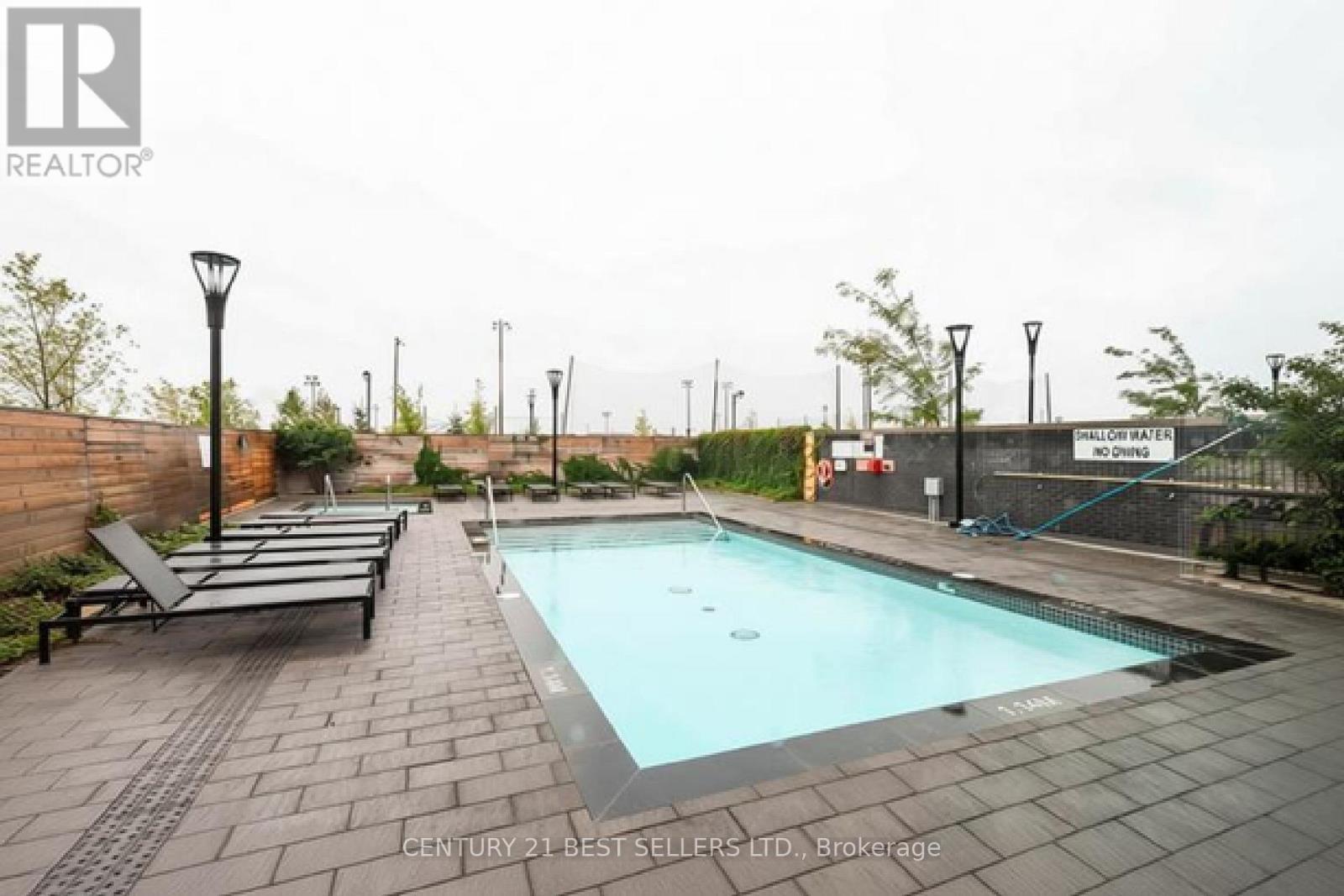 218 - 1050 Main Street E, Milton, ON - Outdoor With In Ground Pool