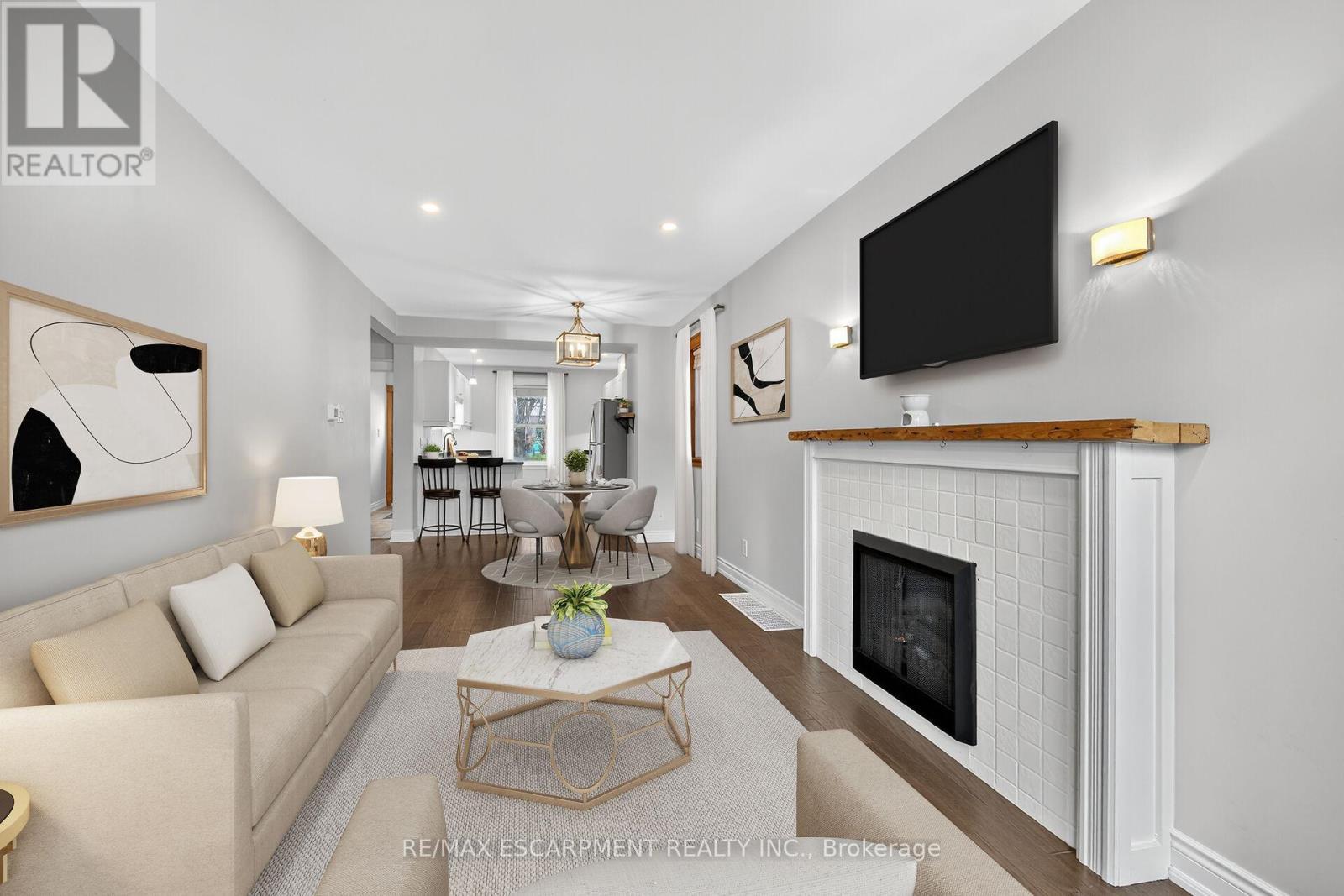 VIRTUALLY STAGED - 266 Wexford Avenue S, Hamilton, ON - Indoor Photo Showing Living Room With Fireplace