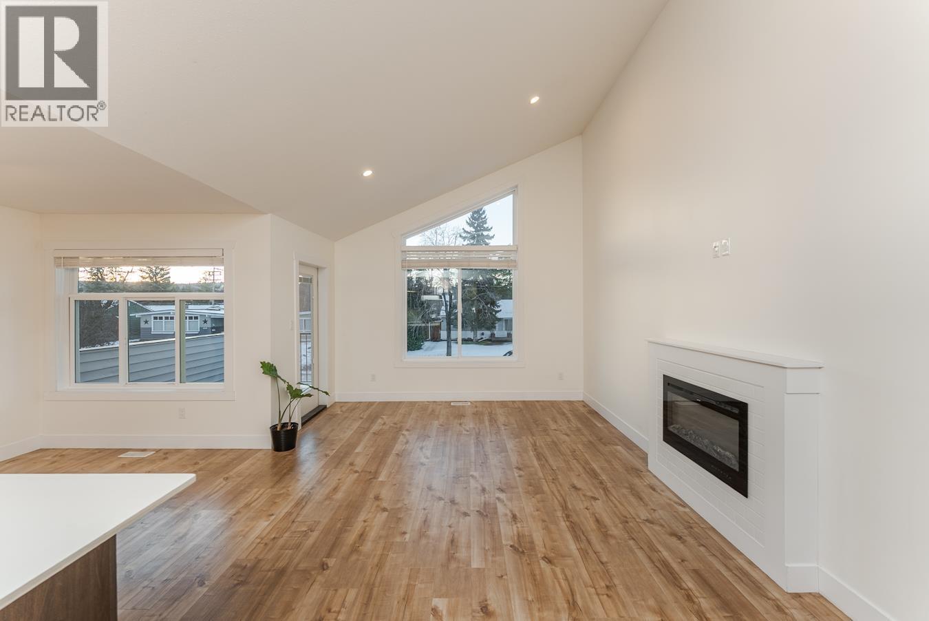 1396 Douglas Street, Prince George, BC - Indoor Photo Showing Other Room With Fireplace