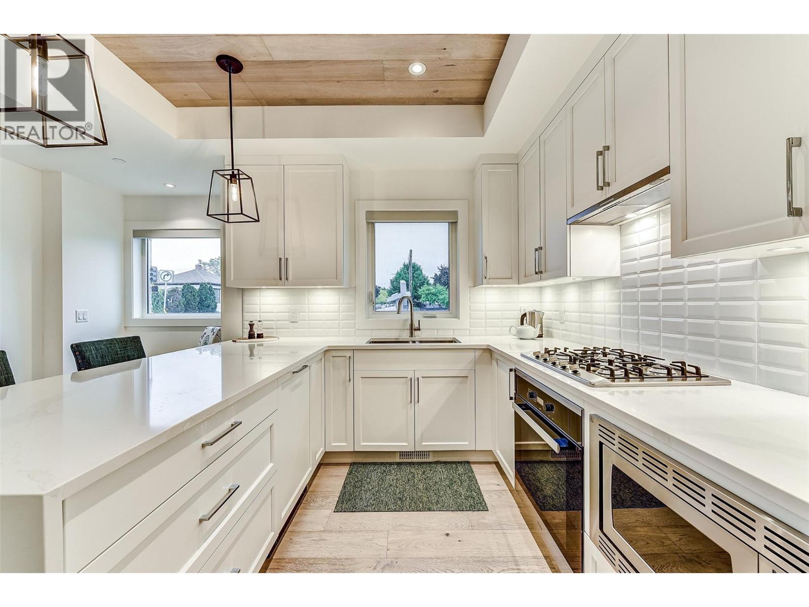 1308 Richter Street Unit# 106, Kelowna, BC - Indoor Photo Showing Kitchen With Double Sink With Upgraded Kitchen