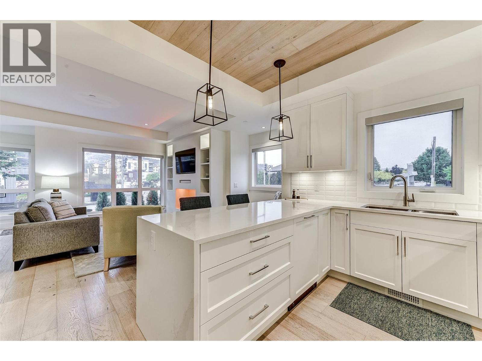 1308 Richter Street Unit# 106, Kelowna, BC - Indoor Photo Showing Kitchen With Double Sink With Upgraded Kitchen
