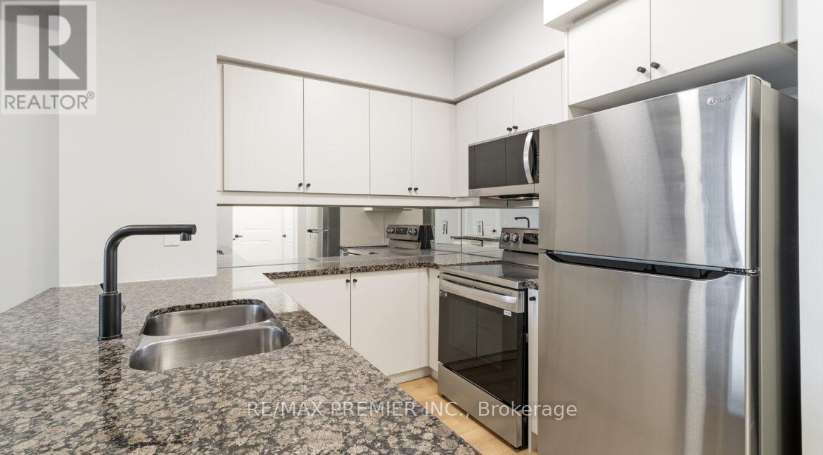 229 - 58 Marine Parade Drive, Toronto, ON - Indoor Photo Showing Kitchen With Double Sink