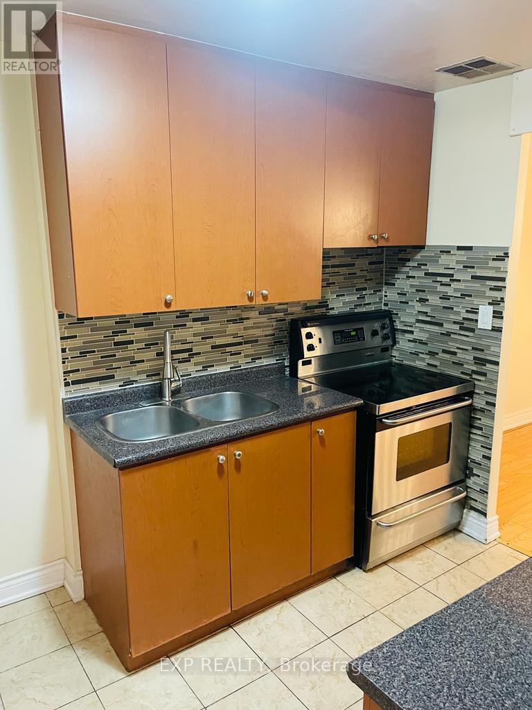 330 - 3025 The Credit Woodlands Road, Mississauga, ON - Indoor Photo Showing Kitchen With Double Sink