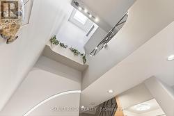 Stylish 2-storey ceiling lit by skylight -