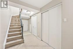 Stairs to the lower level with garage inside entry -