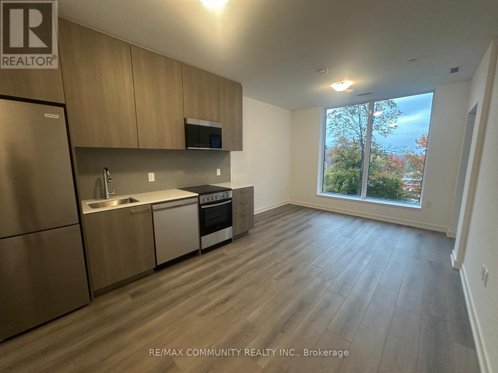 328 - 7439 Kingston Road, Toronto, ON - Indoor Photo Showing Kitchen With Stainless Steel Kitchen