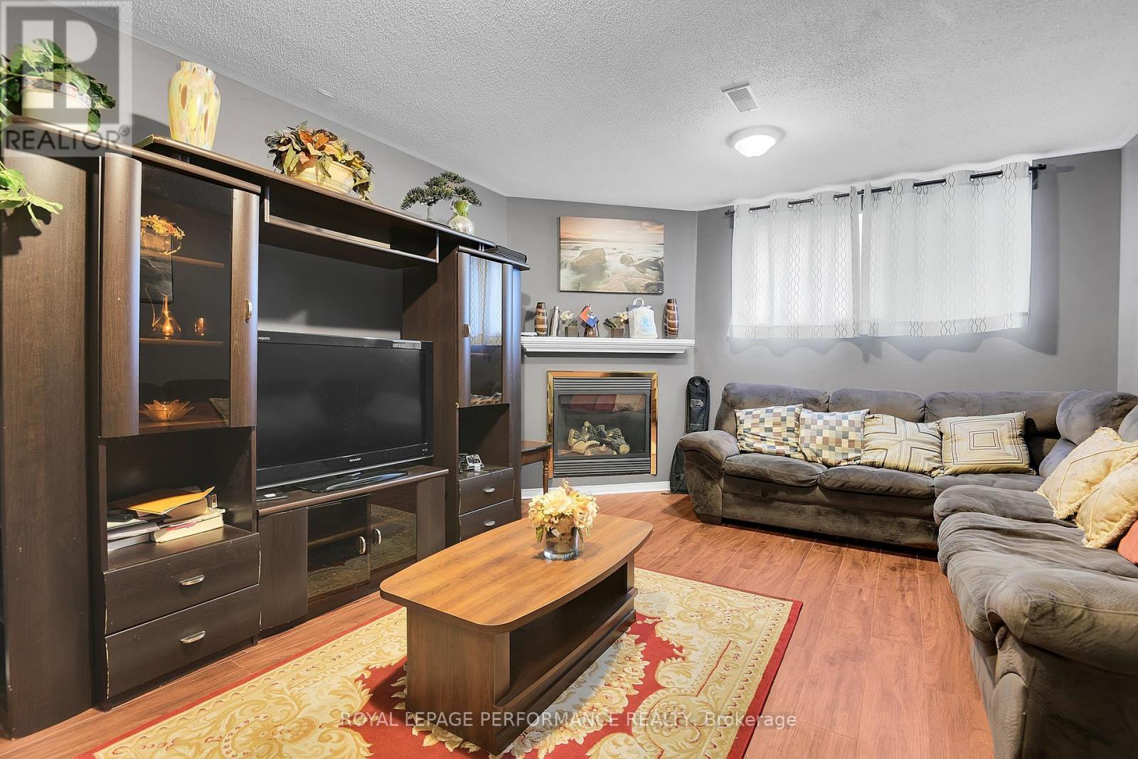 622 Louis Toscano Drive, Ottawa, ON - Indoor Photo Showing Living Room With Fireplace