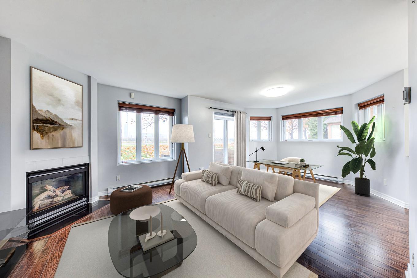 Living room - 101-6795 Av. Raoul, Longueuil (Saint-Hubert), QC - Indoor Photo Showing Living Room With Fireplace
