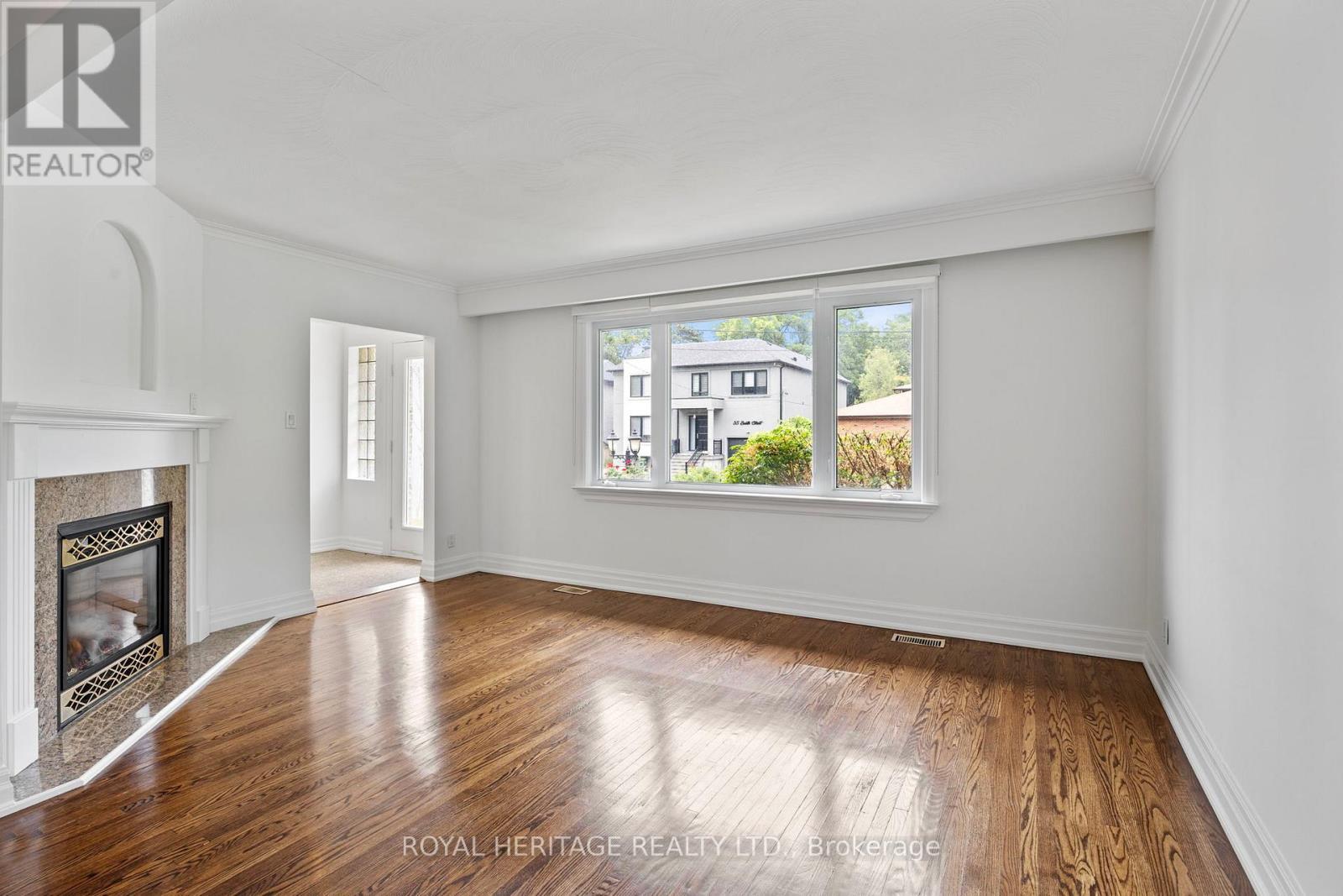 32 Beath Street, Toronto, ON - Indoor Photo Showing Living Room With Fireplace