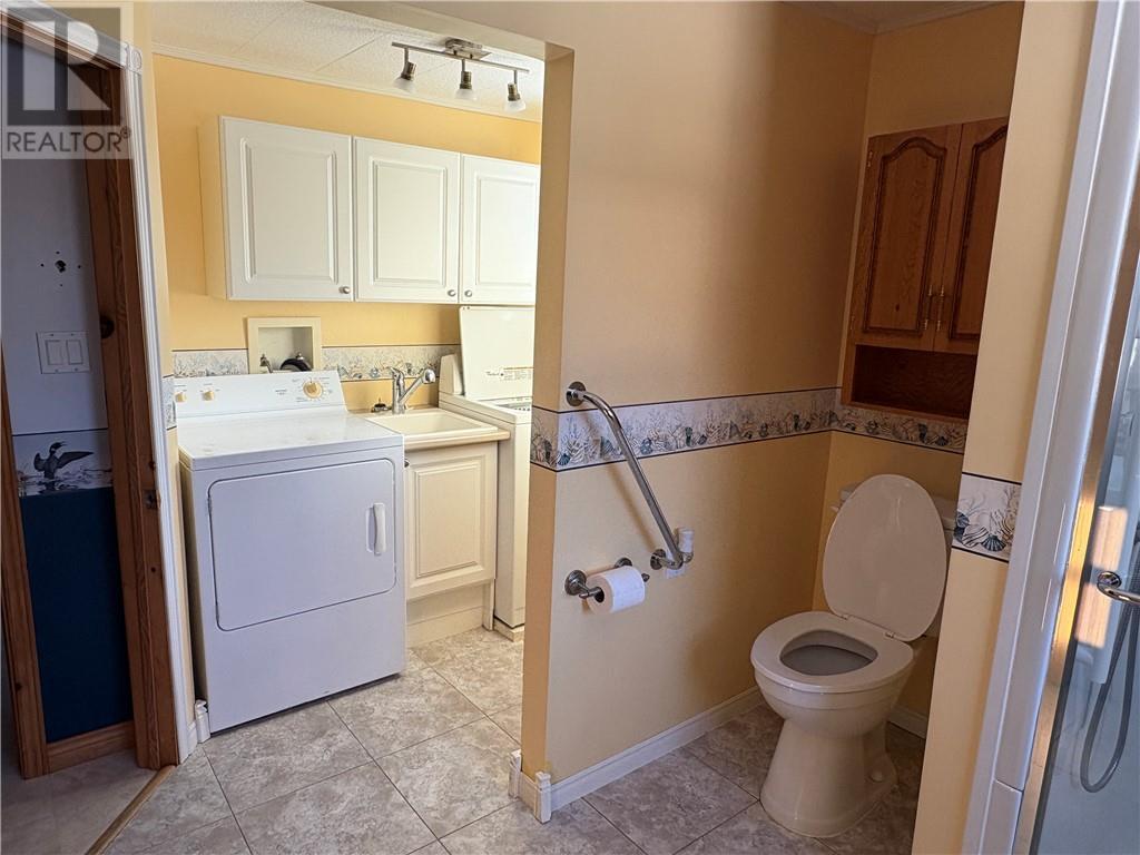 27 Tilley, Killarney, ON - Indoor Photo Showing Laundry Room