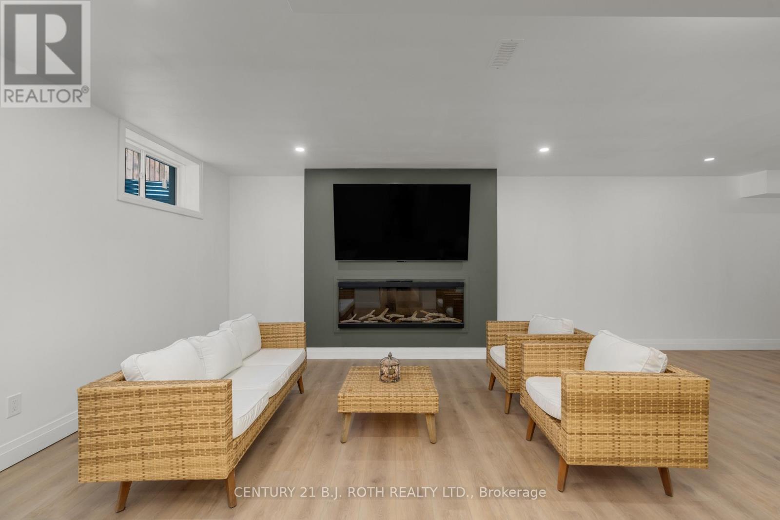19 Rowley Crescent, Springwater, ON - Indoor Photo Showing Living Room With Fireplace