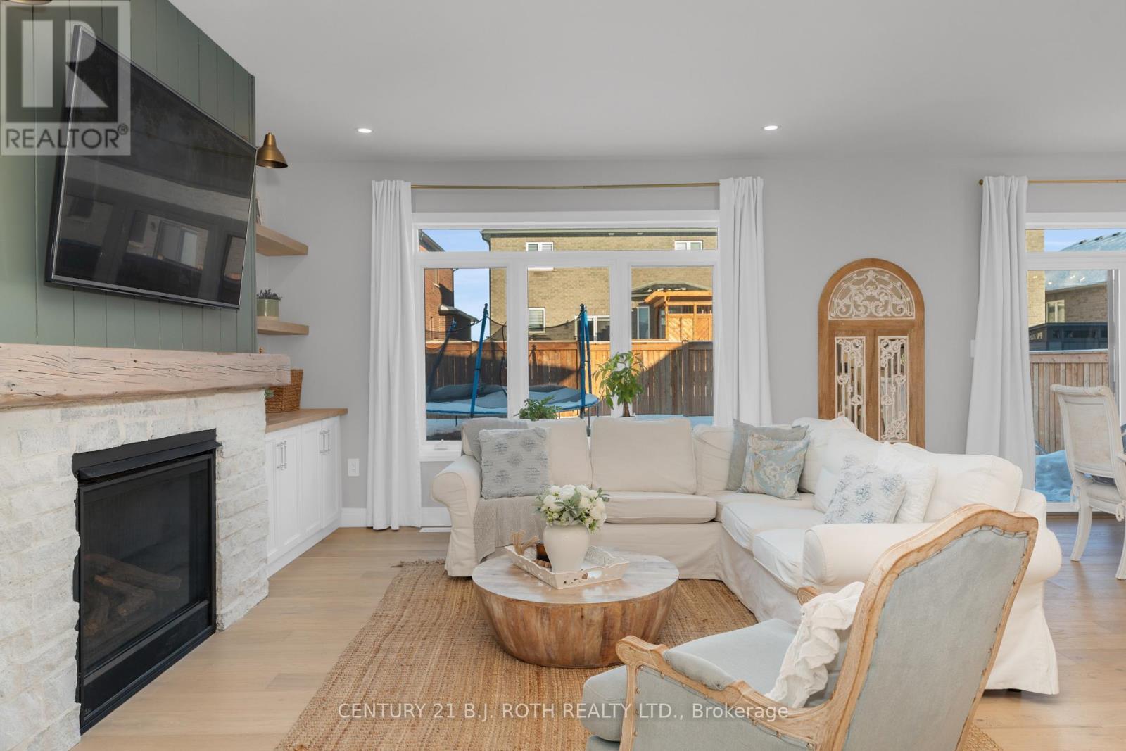 19 Rowley Crescent, Springwater, ON - Indoor Photo Showing Living Room With Fireplace