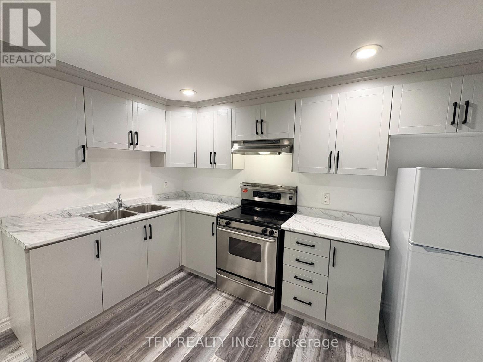 Bsmt - 8 Ravencliff Crescent, Toronto, ON - Indoor Photo Showing Kitchen With Double Sink