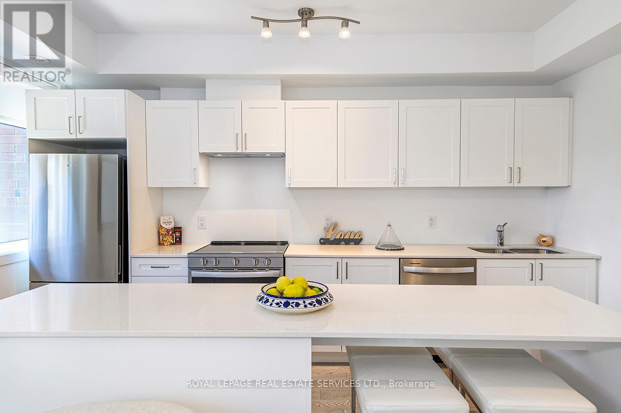 251 - 1075 Douglas Mccurdy Common, Mississauga, ON - Indoor Photo Showing Kitchen With Stainless Steel Kitchen With Double Sink