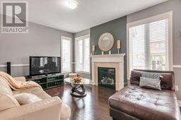 4 Bassett Crescent, Brampton, ON - Indoor Photo Showing Living Room With Fireplace