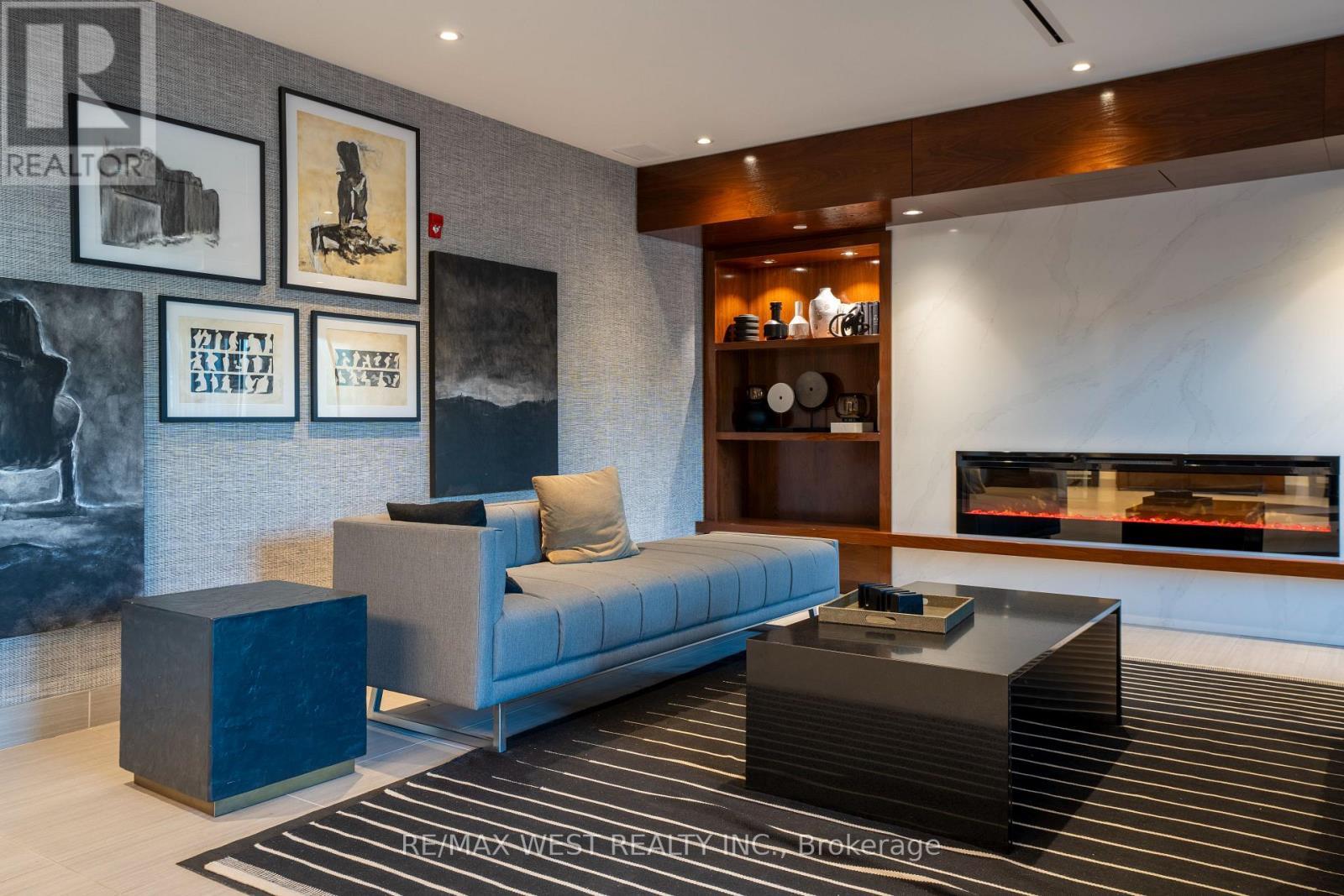 133 - 102 Grovewood Common, Oakville, ON - Indoor With Fireplace