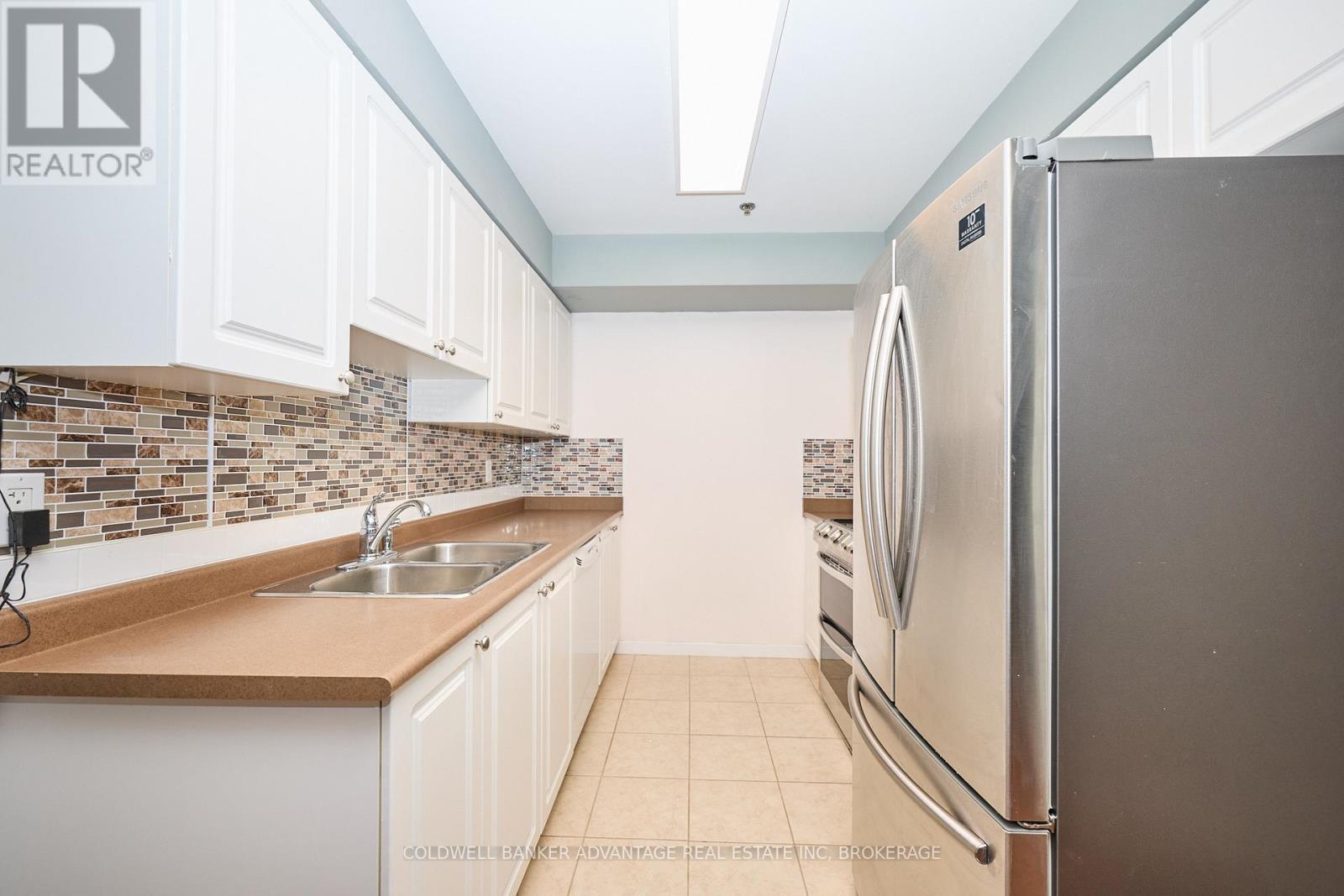 1204 - 330 Prince Charles Drive S, Welland (Broadway), ON - Indoor Photo Showing Kitchen With Stainless Steel Kitchen With Double Sink