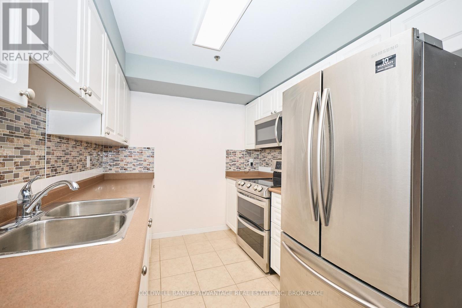 1204 - 330 Prince Charles Drive S, Welland (Broadway), ON - Indoor Photo Showing Kitchen With Stainless Steel Kitchen With Double Sink