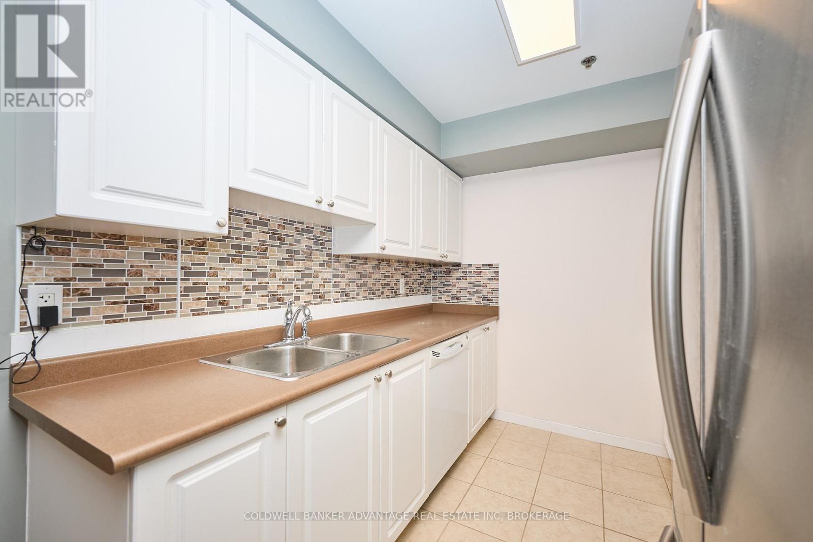1204 - 330 Prince Charles Drive S, Welland (Broadway), ON - Indoor Photo Showing Kitchen With Double Sink