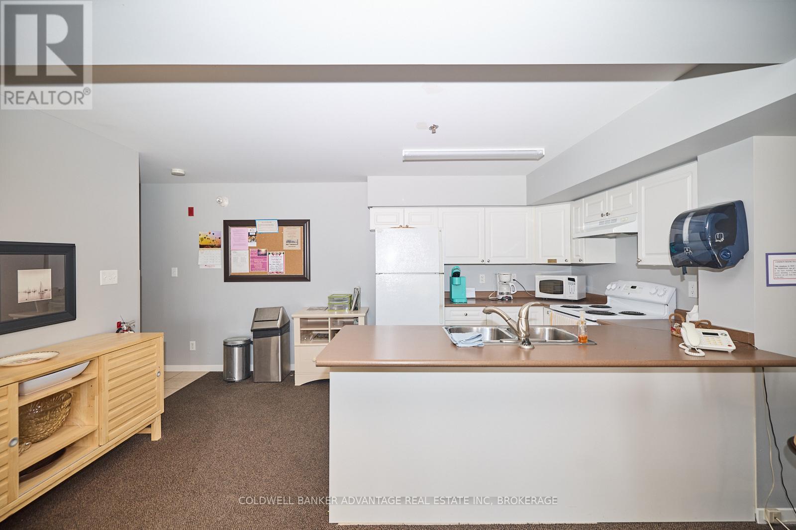 1204 - 330 Prince Charles Drive S, Welland (Broadway), ON - Indoor Photo Showing Kitchen With Double Sink