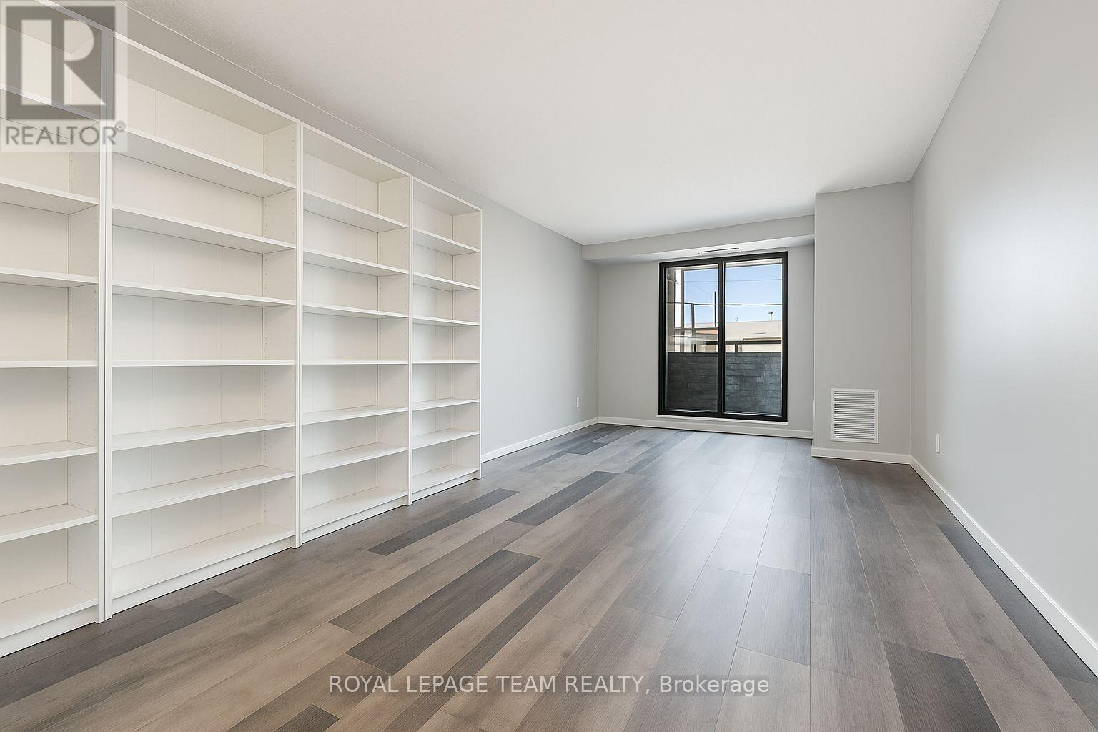 Living Room & shelf unit virtually emptied - 901 - 200 Bay Street, Ottawa, ON - Indoor