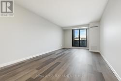 Living Room virtually emptied & without shelving -