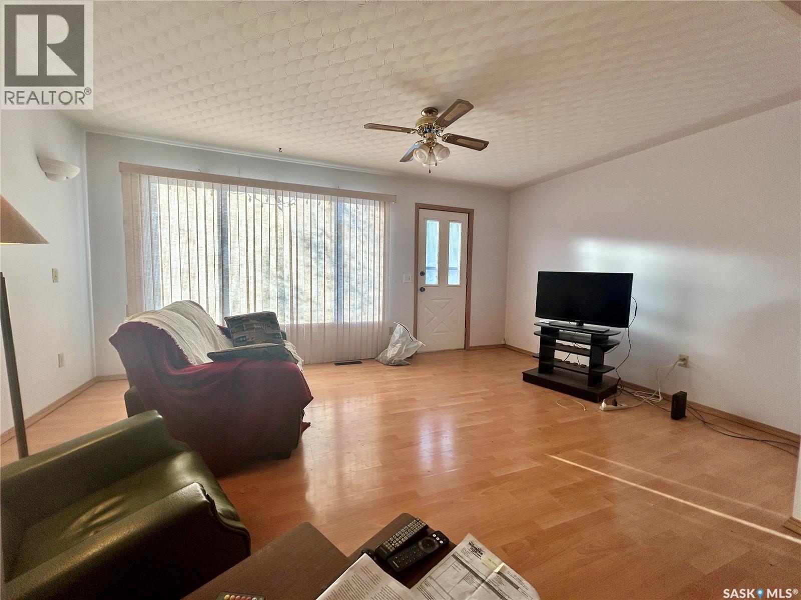 507 Doepker Avenue, Annaheim, SK - Indoor Photo Showing Living Room With Fireplace