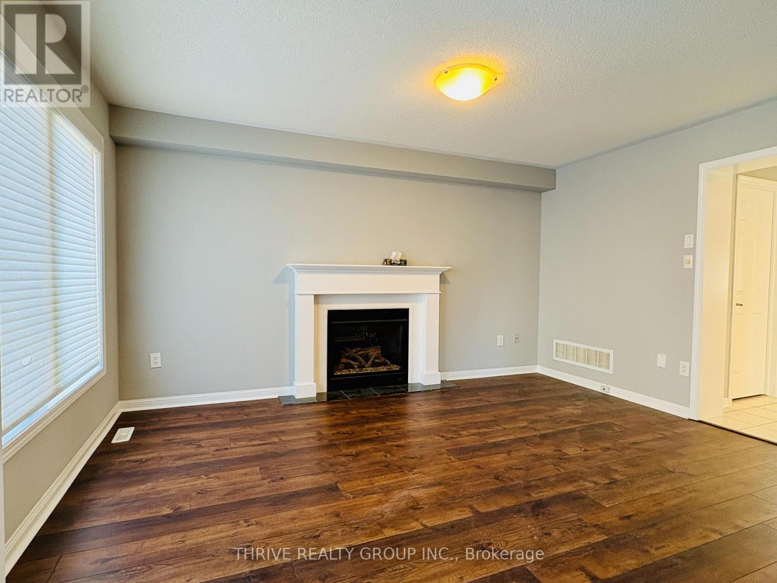 1029 Farmstead. Drive, Milton (Wi Willmott), ON - Indoor Photo Showing Living Room With Fireplace