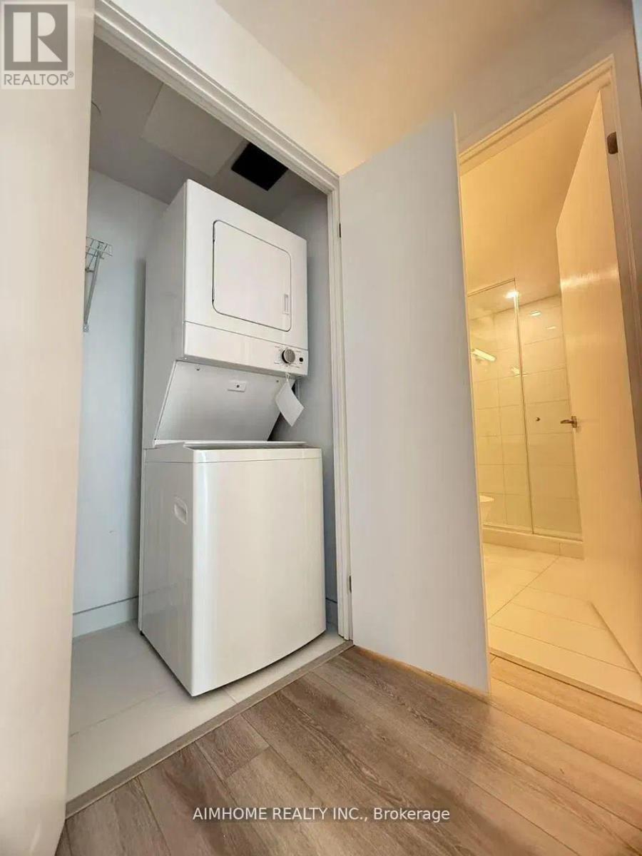 3903 - 238 Simcoe Street, Toronto, ON - Indoor Photo Showing Laundry Room