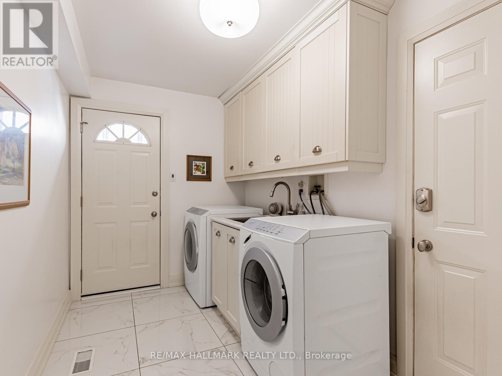 Laundry w/access to garage. Miele washer & dryer - 88 Ames Circle, Toronto, ON - Indoor Photo Showing Laundry Room