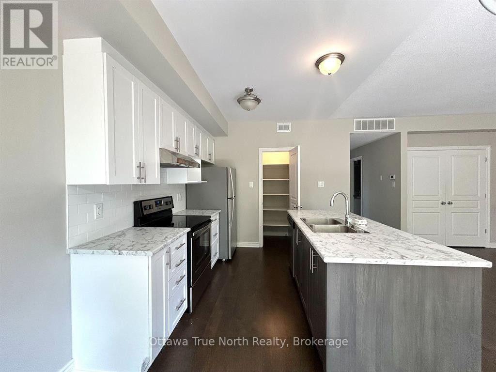 F - 1032 Beryl Private, Ottawa, ON - Indoor Photo Showing Kitchen With Double Sink