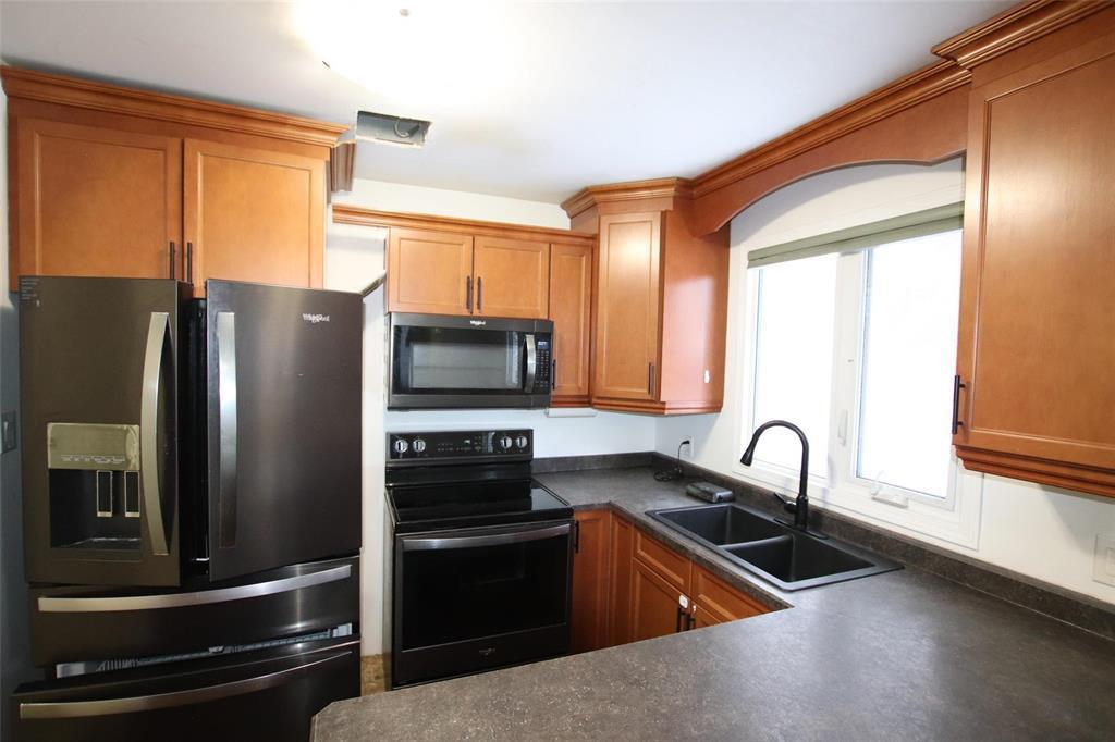 43 Williams Street, The Pas, MB - Indoor Photo Showing Kitchen With Double Sink