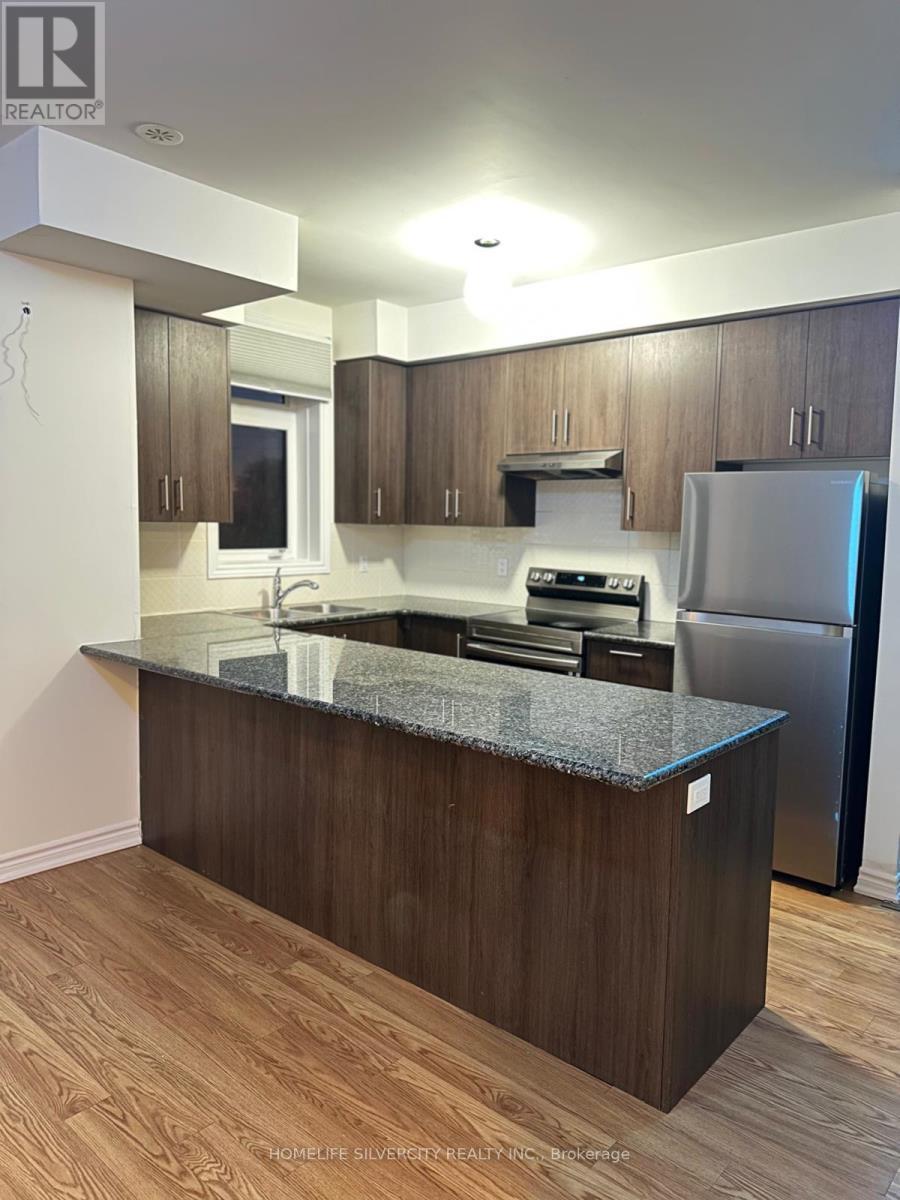 10 - 10 Halliford Place, Brampton, ON - Indoor Photo Showing Kitchen With Double Sink
