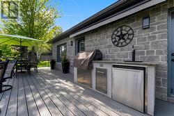 Outdoor kitchen with retractable awning -