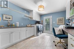 Laundry at garage entry with side yard access -