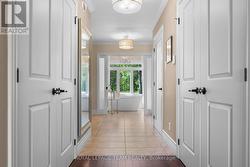 Double walk-in closets. Frosted glass sliding door -