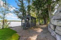 Screened gazebo with interlock path to waterfront -
