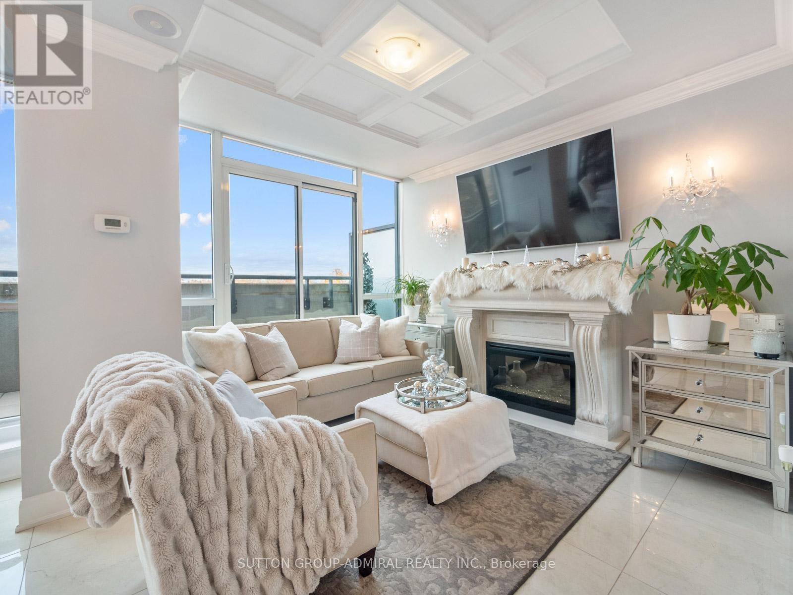 705 - 4700 Highway 7, Vaughan, ON - Indoor Photo Showing Living Room With Fireplace