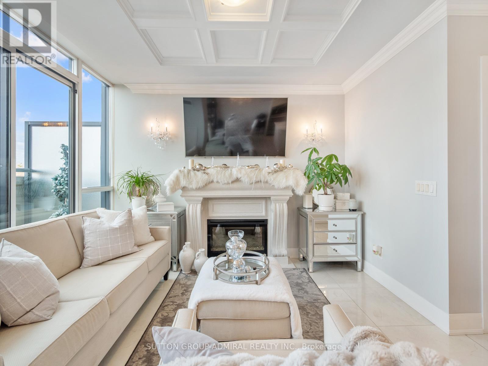 705 - 4700 Highway 7, Vaughan, ON - Indoor Photo Showing Living Room With Fireplace