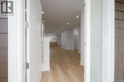 Hallway featuring light hardwood / wood-style flooring -